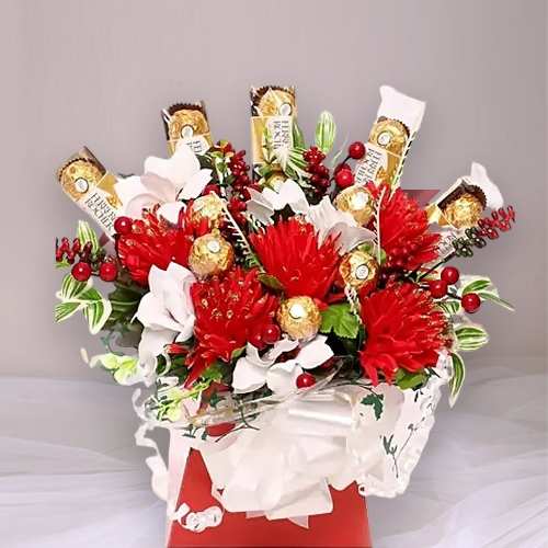 Silk Flower And Ferrero Arrangement
